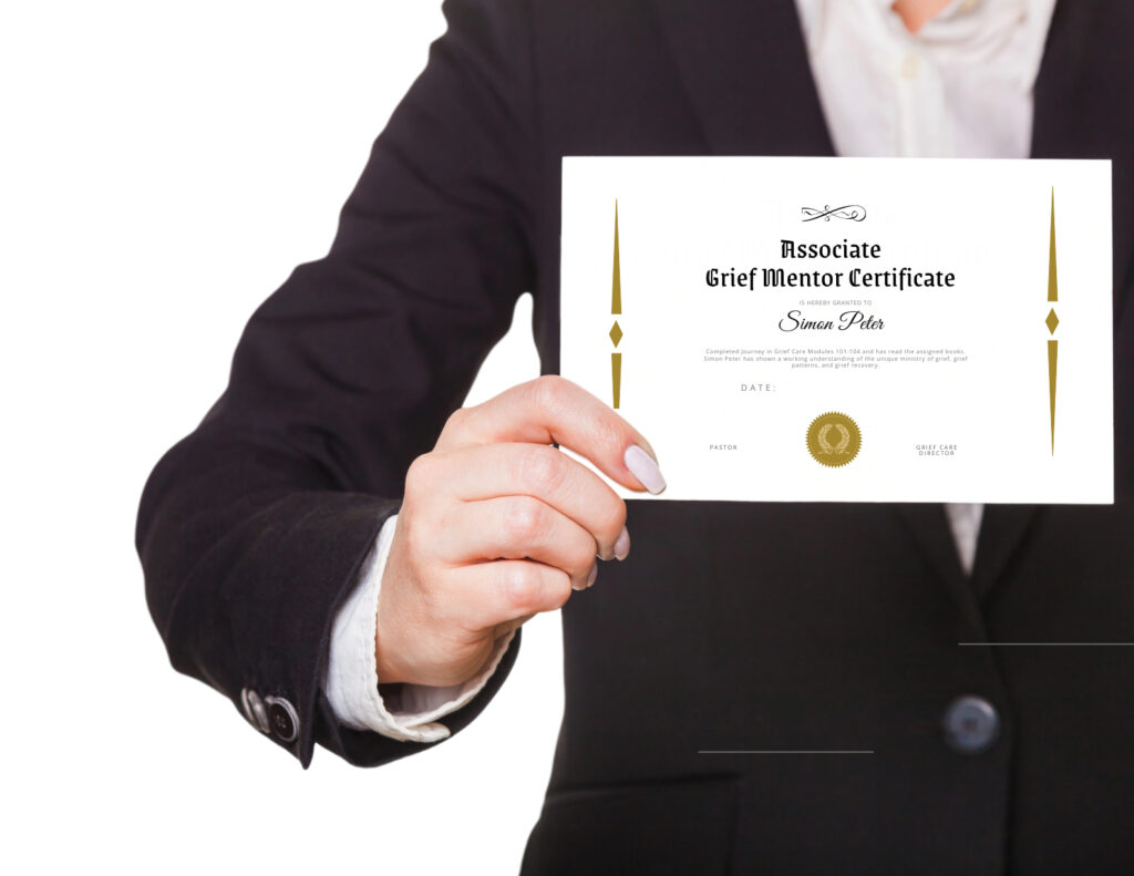 Person holding an associate grief mentor certificate for "Simon Peter"