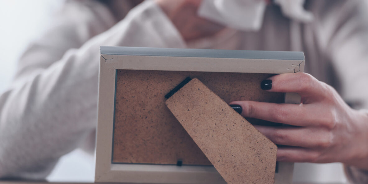 Grieving mother holding a photograph