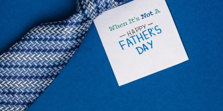 Missing Dad on Father's Day: Blue tie on Blue background, note that says "When it's not a happy father's day"