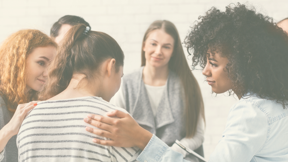 women comforting a grieving friend